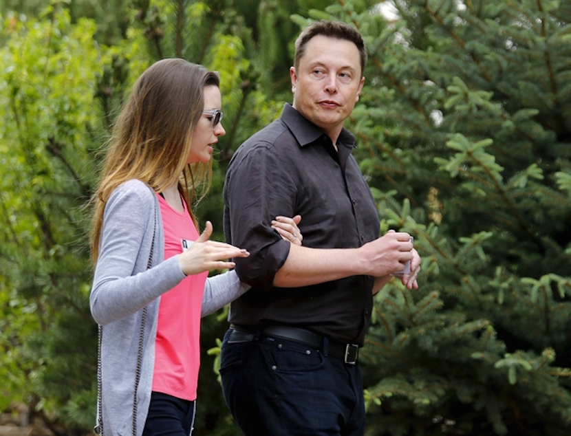Tesla founder Elon Musk walks with his wife, British actress Talulah Riley, during the first day of the annual Allen and Co. media conference in Sun Valley, Idaho, July 8, 2015.  REUTERS/Mike Blake