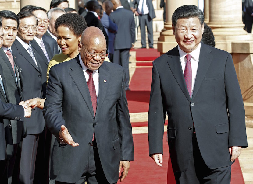 Chinese President Xi Jinping walks with South African President Jacob Zuma upon his arrival at the Union Buildings in Pretoria , December 2, 2015. REUTERS/Sydney Seshibedi